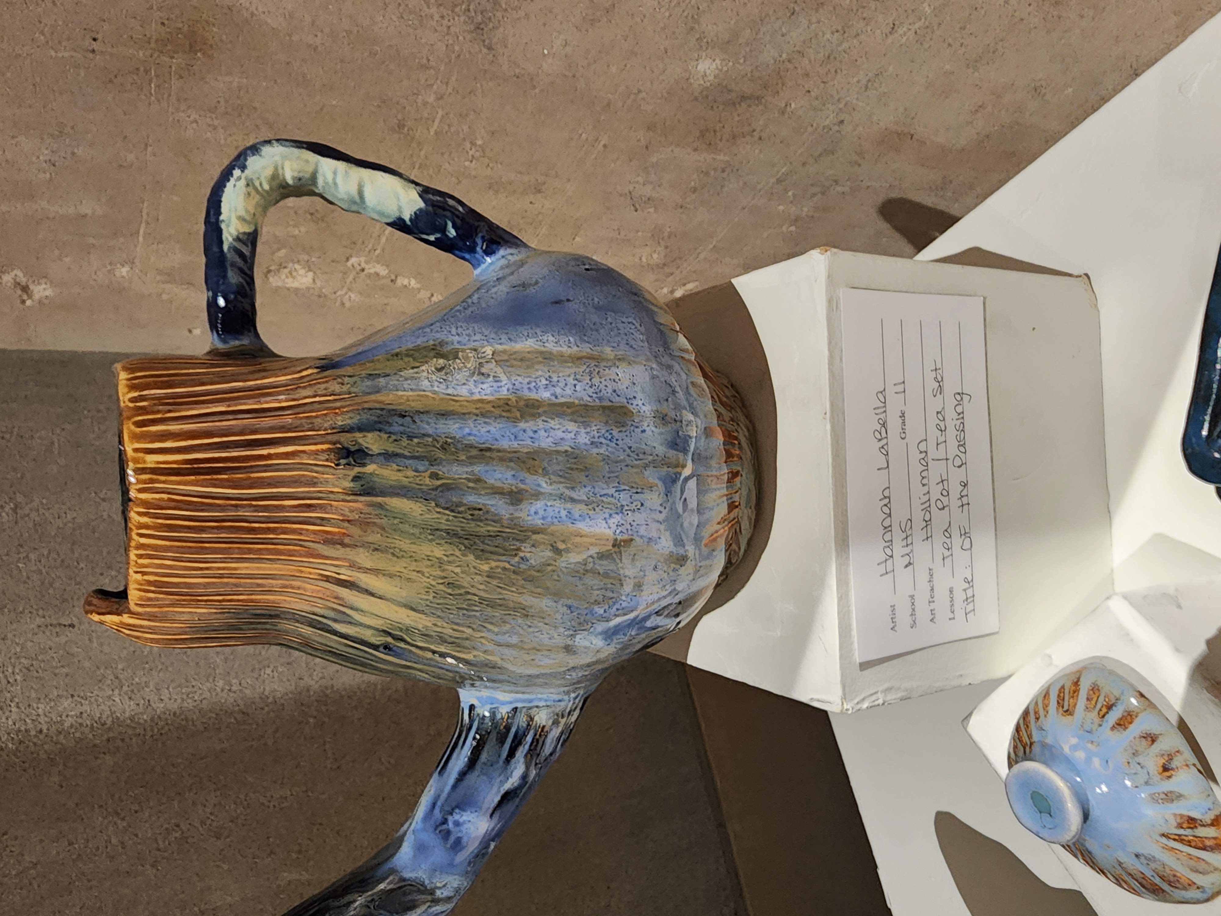 A large teapot piece of pottery on display at the gallery